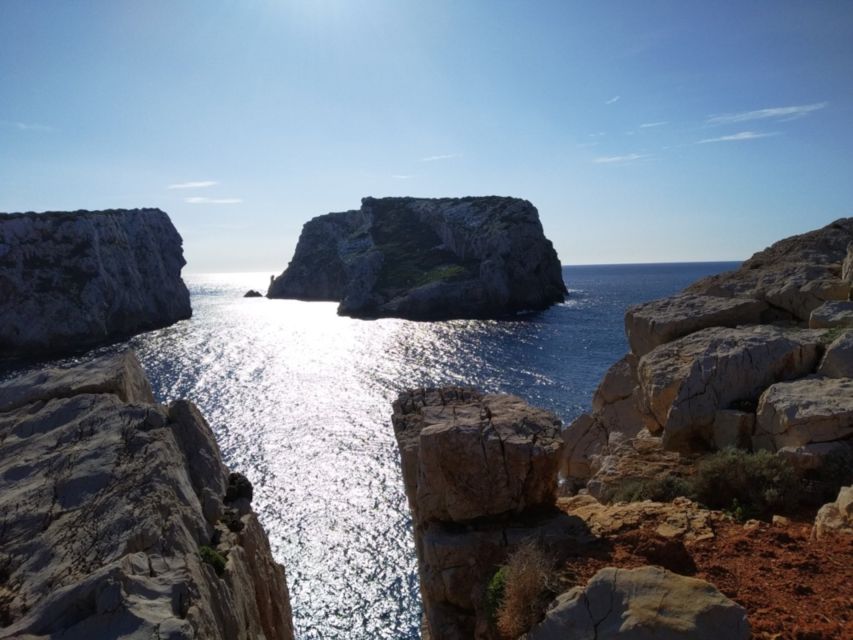 Alghero: sunset sailing tour from Fertilia - Sardinian food and wine at sunset