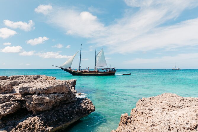 Aruba Jolly Pirate Afternoon Sail with Snorkeling - Rope swing, swimming, and the party atmosphere
