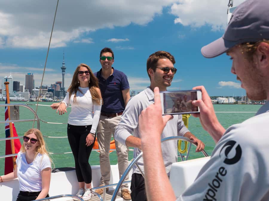 Auckland Harbour 1.5-Hour Sailing Cruise - Taking the helm and helping with the sails