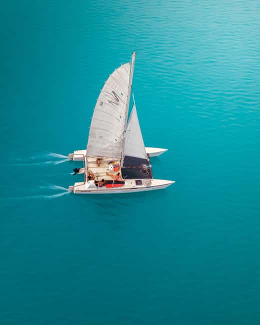 Bacalar: Shared Sunset Sailboat Tour - Three swimming stops break up the sailing
