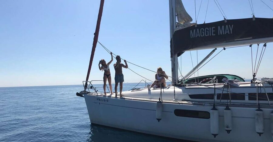 Barcelona: 2-Hour Sailboat Tour with Paddle Boarding - Lowering the sail for a Mediterranean swim