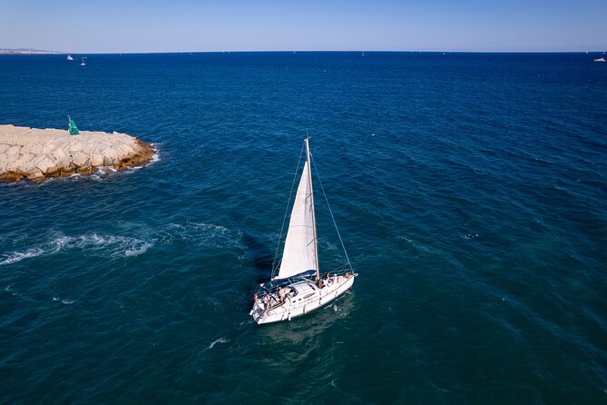 Barcelona Badalona Sailboat Tour Snack Drinks Swimming Sunset - Setting out from Moll Nord in Badalona