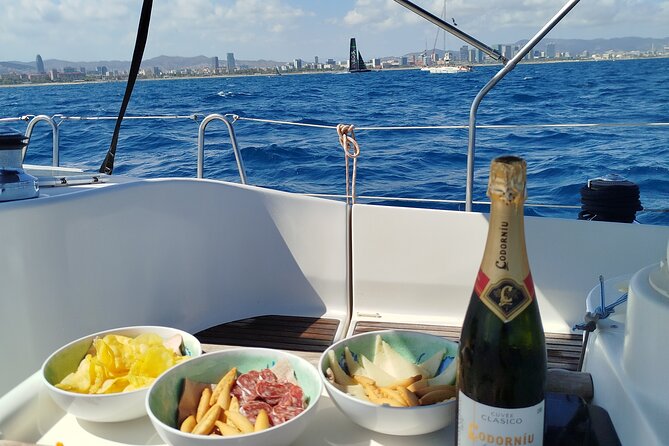 Barcelona Badalona Sailboat Tour Snack Drinks Swimming Sunset - Barcelona from the sea, with binoculars provided