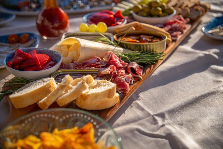 Barcelona: Local Tapas and Drinks Sailing Adventure Tour - The food: seafood conserves, charcuterie, and simple Catalan bites