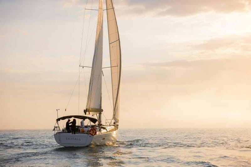Barcelona: Luxury Sunset Sailboat Tour from Port Olimpic - Sunset behind Tibidabo