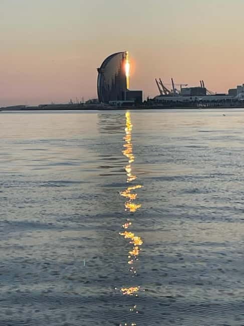 Barcelona: Luxury Sunset Sailboat Tour from Port Olimpic - Taking the helm on the Skyfall