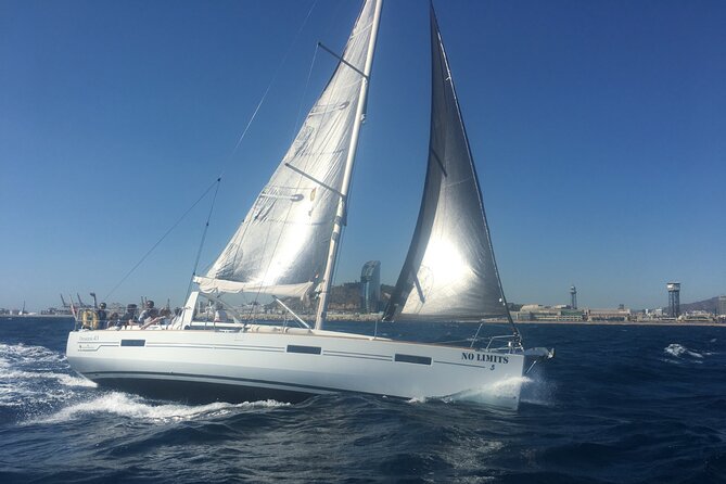 Barcelona: Mediterranean Sailing Experience with Open Bar - Taking the helm and working the sails