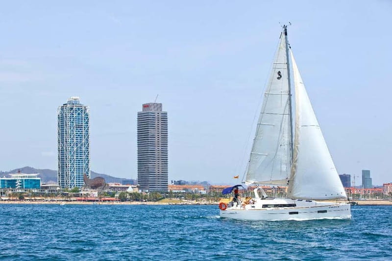 Barcelona: Private Sailing Trip with Drinks & Snacks (max 9) - Barcelona’s old port and the view back to shore