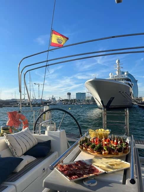 Barcelona: Sailing Tour + Food, Drinks, Swim & Sunset Option - Meeting at Port Vela by Barceloneta Beach