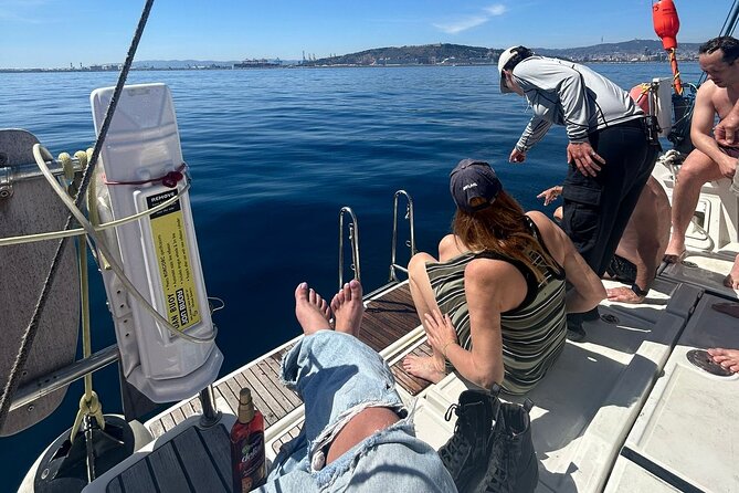 Barcelona: Sailing Tour with Tapas, Drinks, Swim & Sunset Option - Booking, weather, and cancellation details