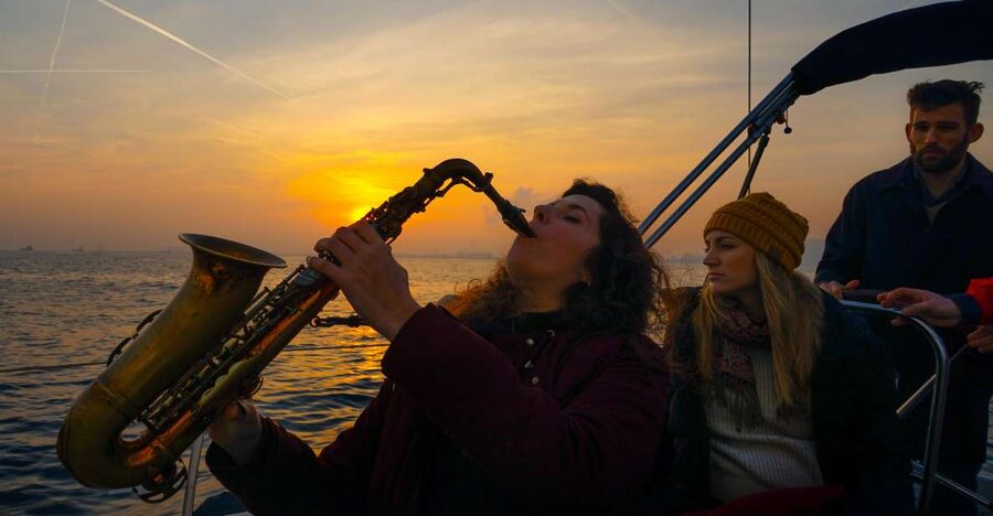 Barcelona: Sunset Live Sax and Sailing Experience with Tapas - The Barcelona skyline from the sea