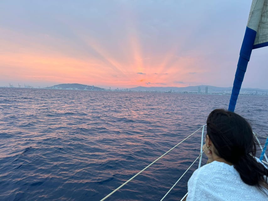 Barcelona: Sunset Sailboat Cruise with Drinks and Snacks - A sunset view of Barcelona from the sea