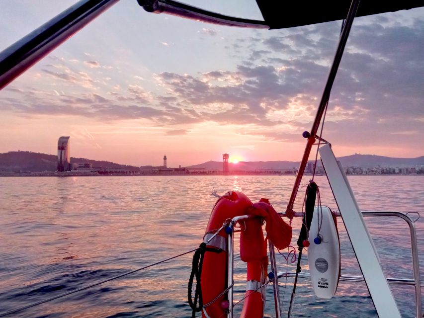 Barcelona: Sunset Sailing Tour with Open Bar & Snacks - Passing the golden fish and twin towers
