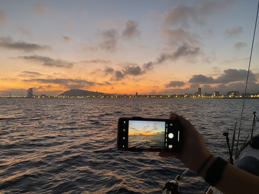 Barcelona: Sunset Sailing Tour with Open Bar & Snacks - The swim stop depends on the sea