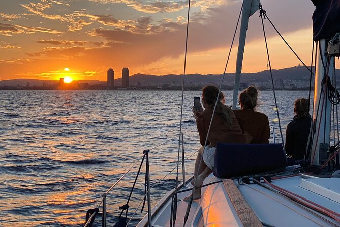 Barcelona Sunset Sailing with Open Bar of Cava and Snacks - Montjuic and the return across the bay
