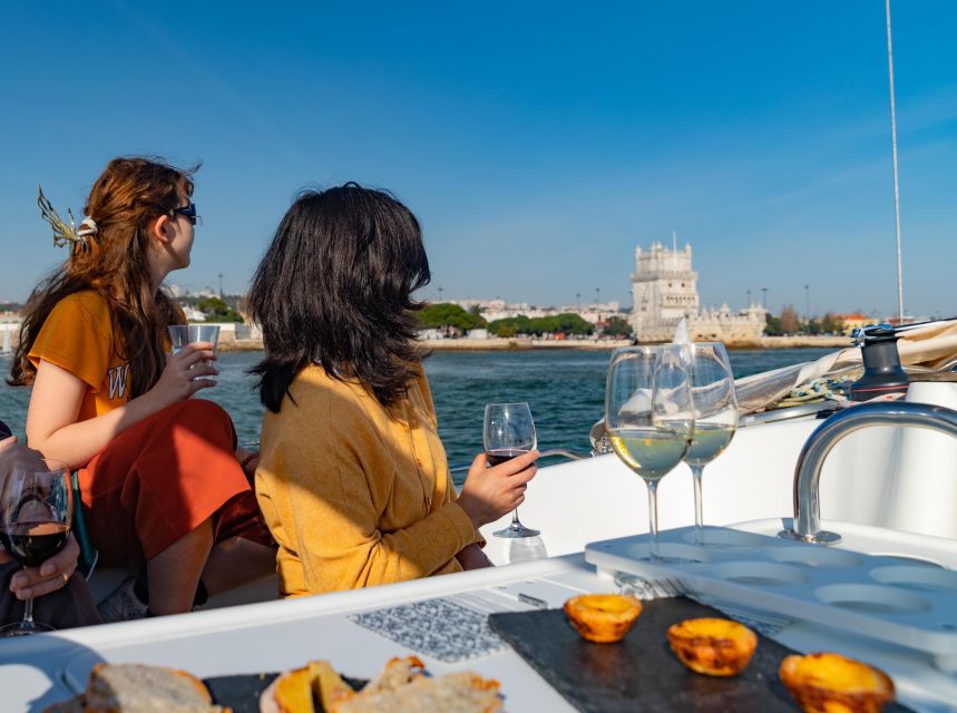 ⛵Bluemotion Lisbon⛵: Wine tasting w/ Sommelier on a sailboat - A tasting table with Lisbon moving past