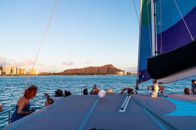 Board from Waikiki Beach for a scenic Sunset Sail on the Hāwea - Settling into the 50-foot catamaran