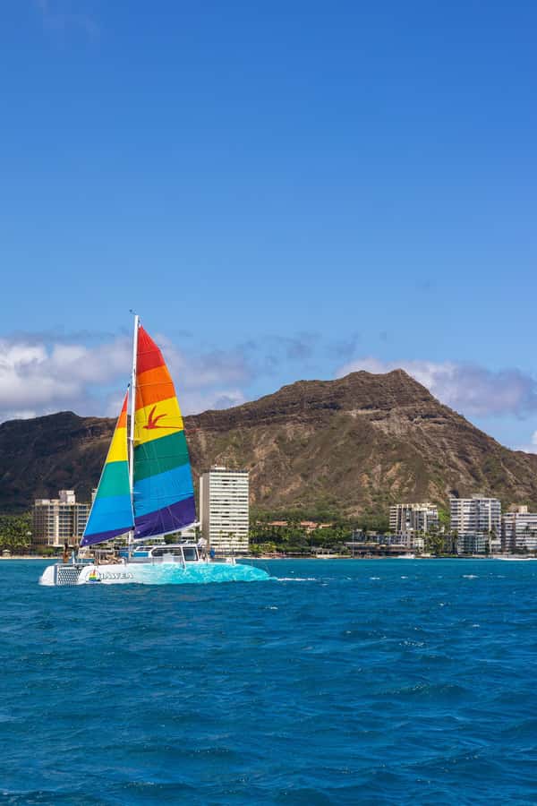 Board from Waikiki Beach for our Aloha Hour Sail - Boarding Behind the Duke Kahanamoku Statue