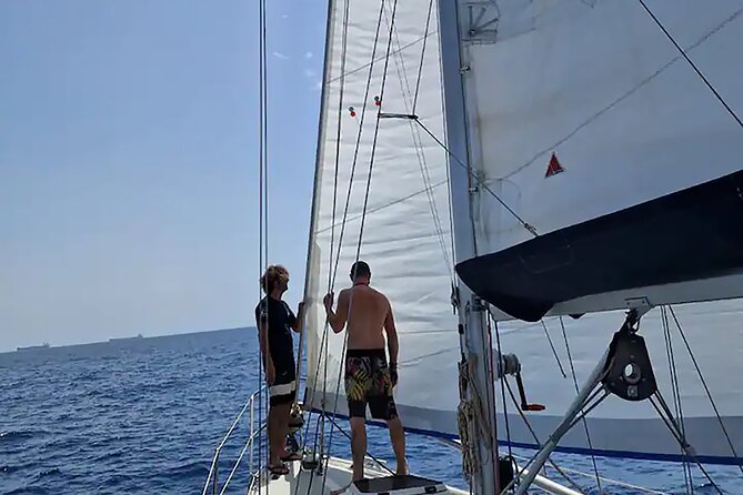 Boat Tour with Drink and Picoteo, Barcelona - Paddleboard, fishing rod, and time on the water