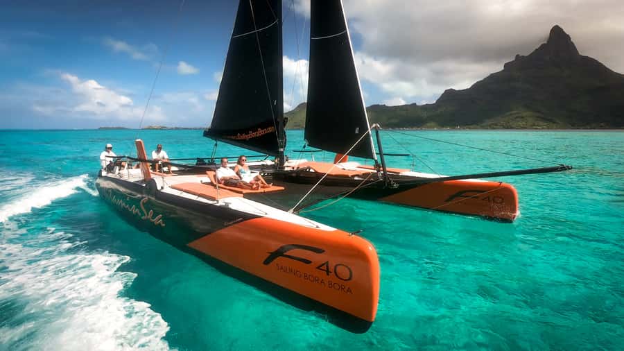 Bora Bora: Half Day Catamaran Sailing & Snorkelling - A speedboat pickup before the sailing begins