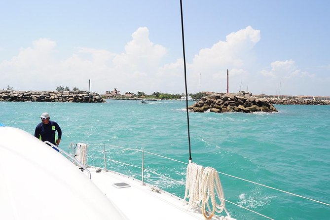 Catamaran Sail and Snorkeling Tour with Open Bar in Puerto Morelos - Hotel pickup, marina transfers, and the $20 dock fee
