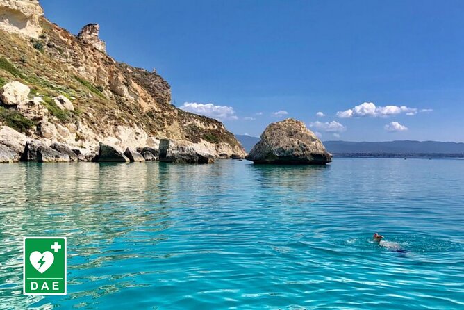 Catamaran tour stops bathing and snorkeling toast with prosecco - Leaving Cagliari port with the city behind you