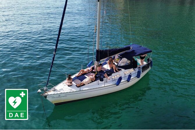 Catamaran tour stops bathing and snorkeling toast with prosecco - Cala Mosca and the first coastal sights