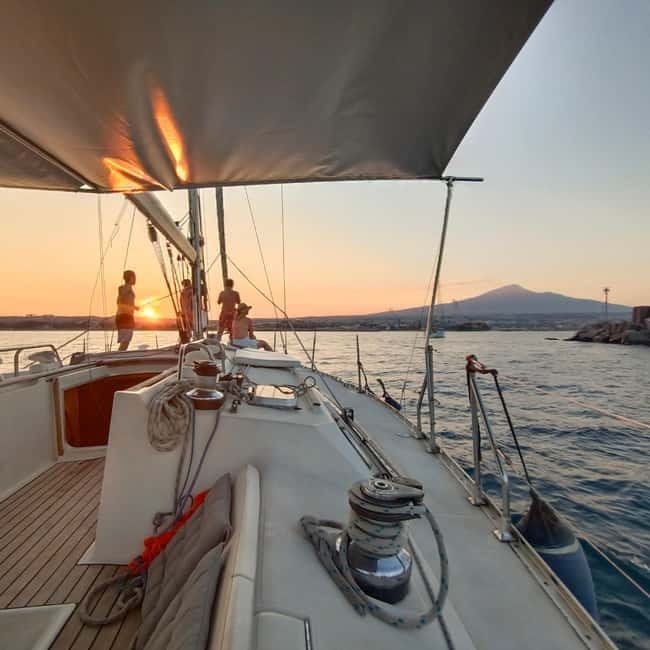 Catania: Coastline Sailing Tour with Aperitif - The Ulysses Caves and volcanic sea