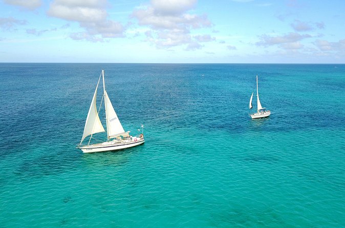 Coral Sunset Sail with 3 Course Dinner in Aruba - Sailing past Nikki Beach and the cruise terminal