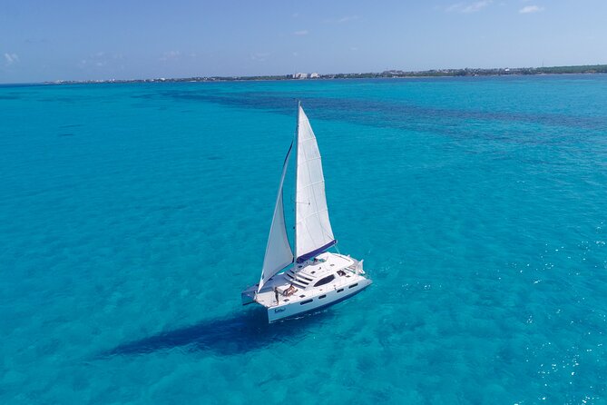Cozumel Luxury Sailing & Snorkeling Cruise Experience - Sailing the Cozumel coast by catamaran