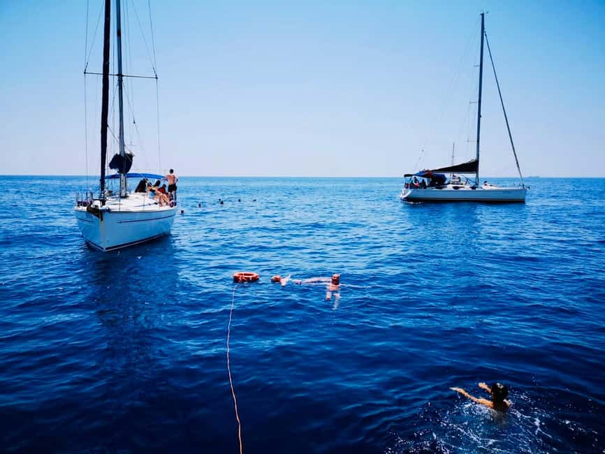 Discover the magic of sailing: a boat tour in Catania - The Grotte di Ulisse and time in the water