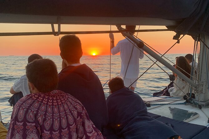 Douro Sunset Sailboat Experience in Porto - Sunset, Porto Tónico, and simple snacks