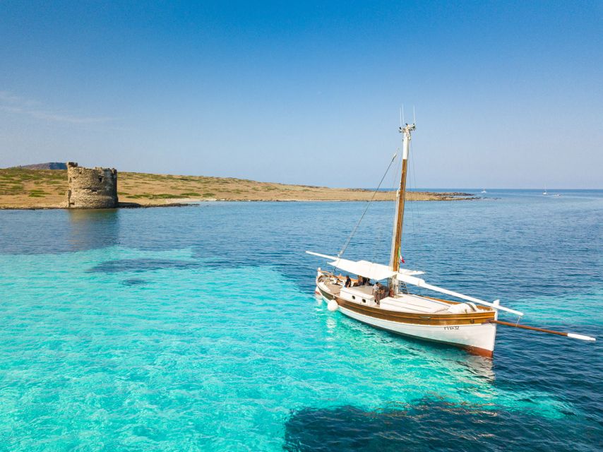 From Stintino: Asinara Vintage Sailing Boat Tour with Lunch - Cala Barche brings the first swim