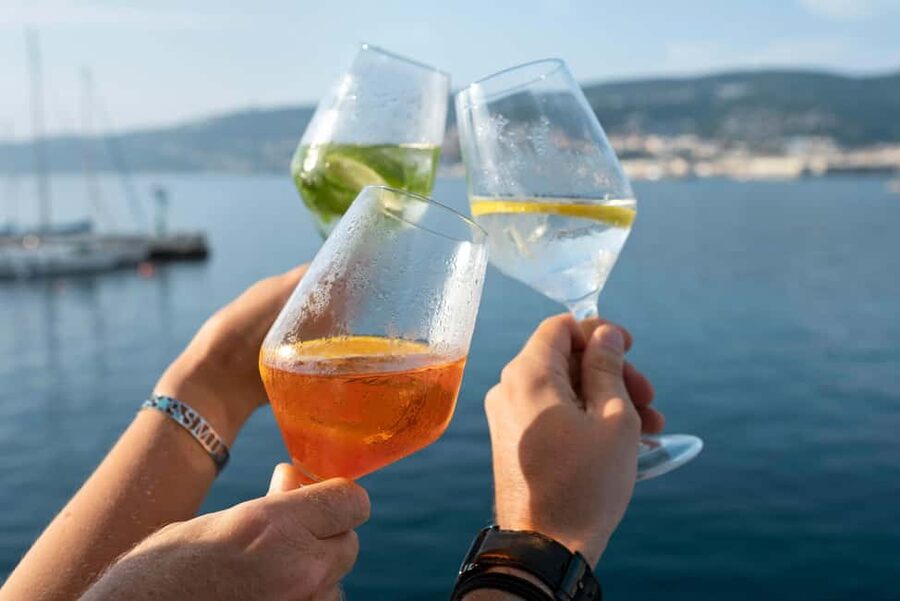 Half-Day Sailing Tour in Catania with Aperitif on Board - The water stop: swimming, snorkeling, and paddleboarding