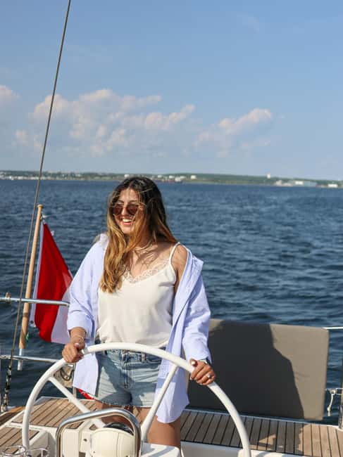 Halifax: Sunset Wine and Cheese Sailboat Cruise - Hoisting sails near George’s Island
