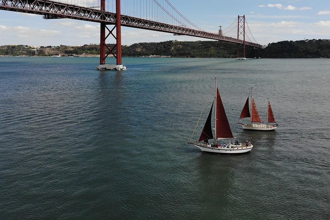 Hen Party in Lisbon on a vintage Sailboat - The 25th of April Bridge and Christ the King
