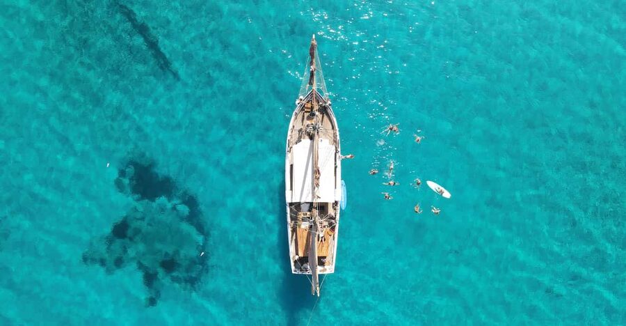 Ibiza Wooden Sail Boat Trip to Formentera - Arriving at Formentera for water activities