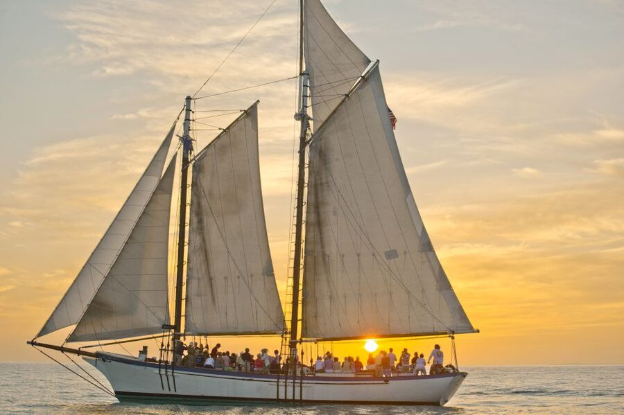 Key West: Windjammer Champagne Sunset Sail - Raising the sails by hand