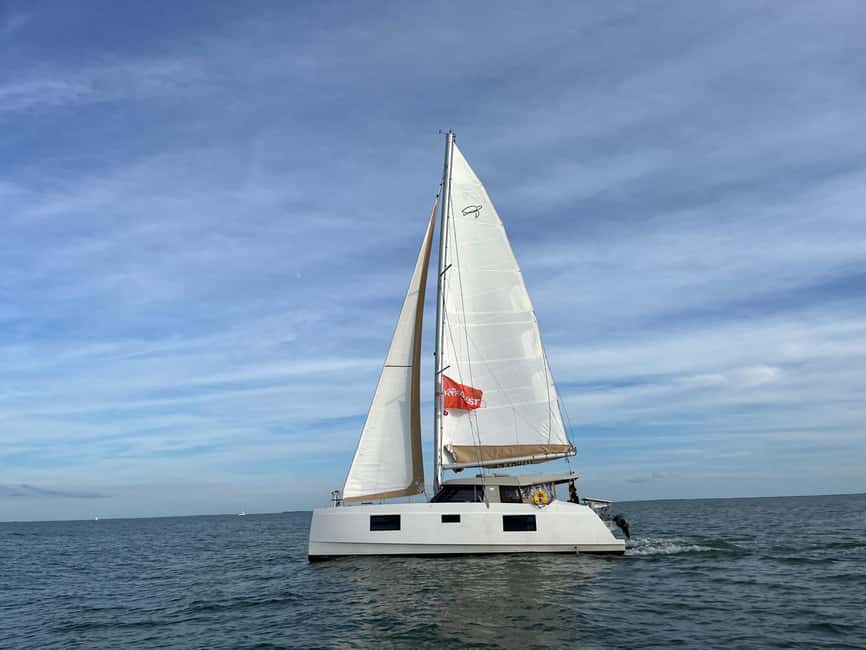 La Flotte, Ile de Ré: Sailing Catamaran Cruise - The Abbaye des Châteliers from offshore