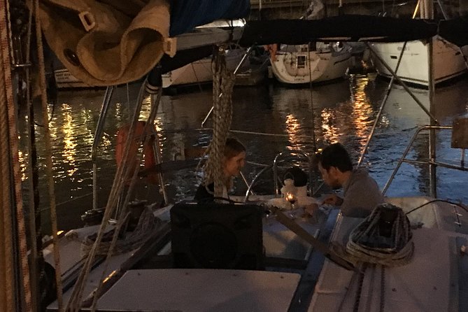 Lisbon by Night Sailing Tour with White or Rosé Wine & Light Snacks - Under the 25th of April Bridge