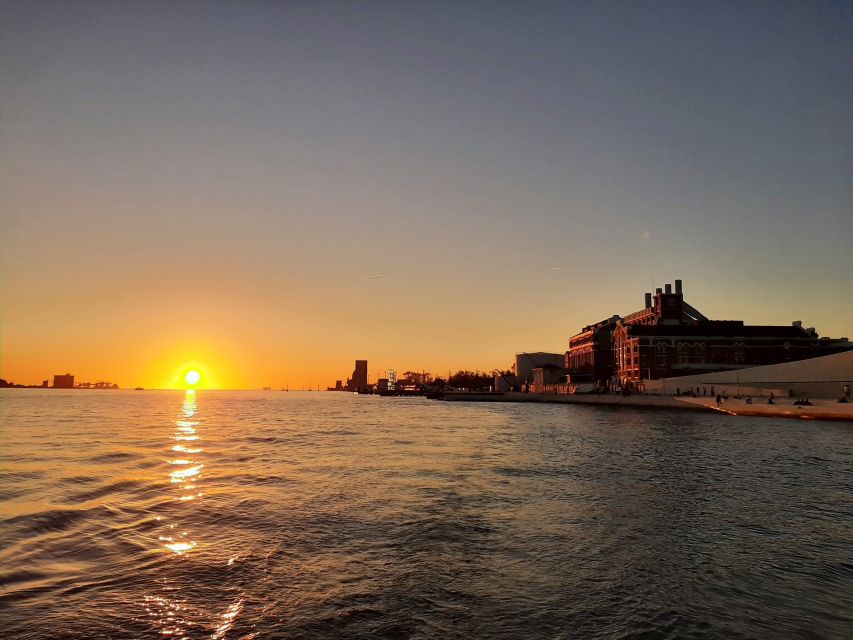 Lisbon: City Skyline Sailboat Cruise with Drink and Snacks - Praça do Comércio and old Lisbon from the water