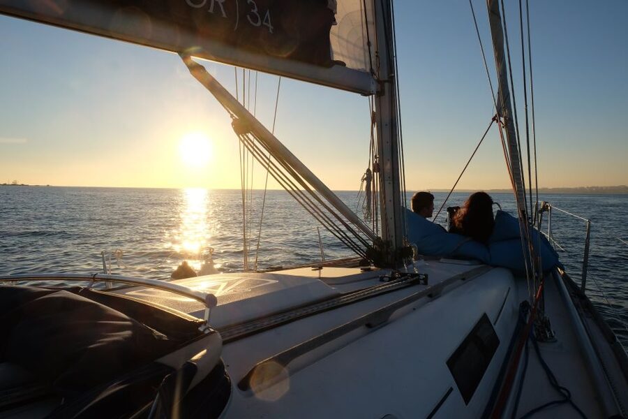 Lisbon: City Skyline Sailboat Cruise with Drink and Snacks - Under the bridge toward Belém
