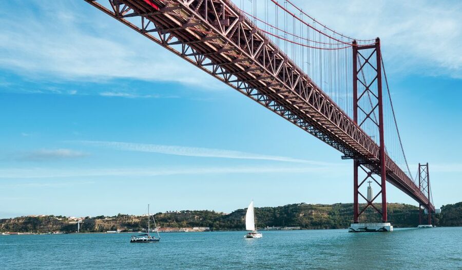 Lisbon: City Skyline Sailboat Cruise with Drink and Snacks - Starting beneath the 25 de Abril Bridge
