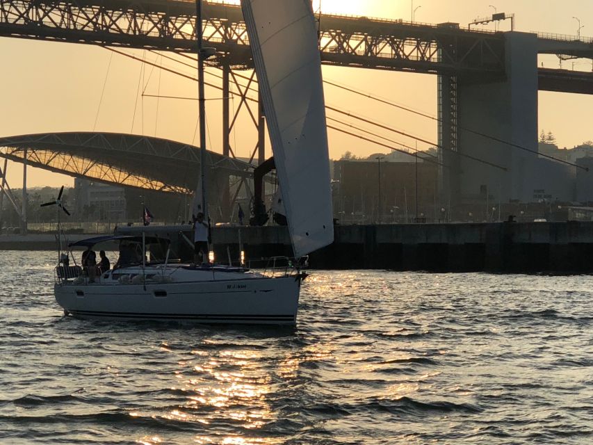 Lisbon: Enjoy a Sunset or Night Tagus River Sailboat Cruise - Boarding in Belém with a drink in hand
