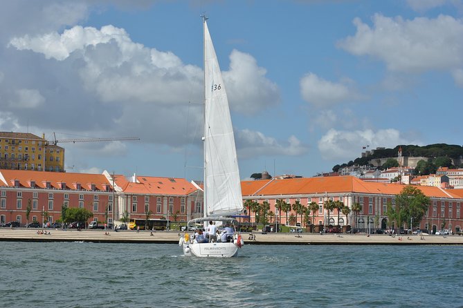 Lisbon Small Group Day Cruise with Historic Commentary & a Drink - Passing beneath the 25 de Abril Bridge