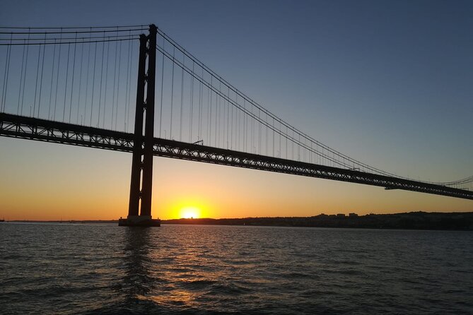 Lisbon: Sunset Sailing with Portuguese Wine and History - Cristo Rei from across the water