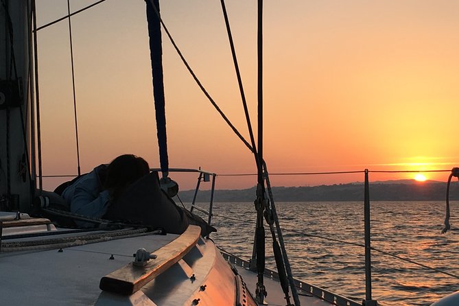 Lisbon Sunset Sensations on a Private Sailing Boat with wine&snacks - Under the 25 de Abril Bridge