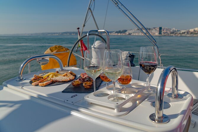 Lisbon: Wine Tasting with Sommelier on a Private Sailboat - Crossing beneath the suspension bridge