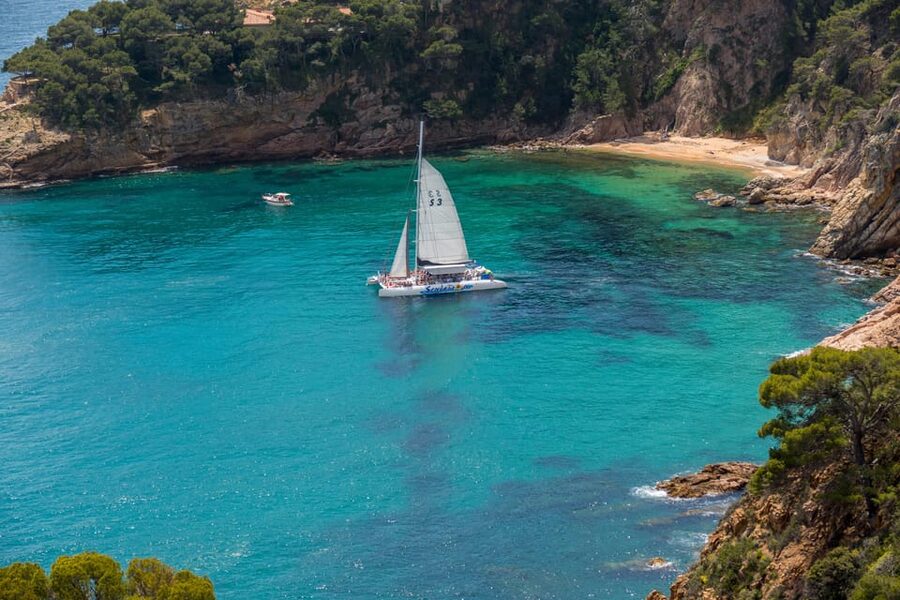 Lloret de Mar: Catamaran Sailing Cruise with BBQ and Drinks - Sailing out from Lloret beach