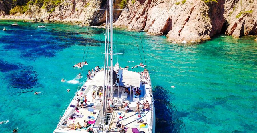 Lloret de Mar: Catamaran Sailing Cruise with BBQ and Drinks - Two hours anchored for swimming and lunch